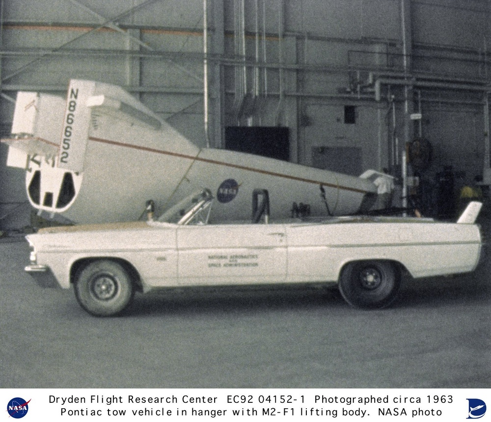 M2-F1 in hangar with Pontiac tow vehicle