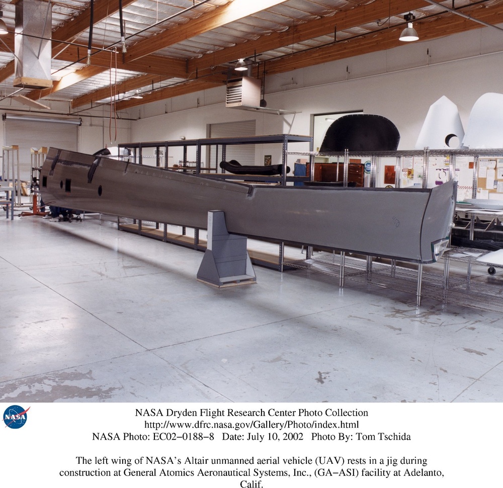 The left wing of NASA's Altair unmanned aerial vehicle (UAV) rests in a jig during construction at G