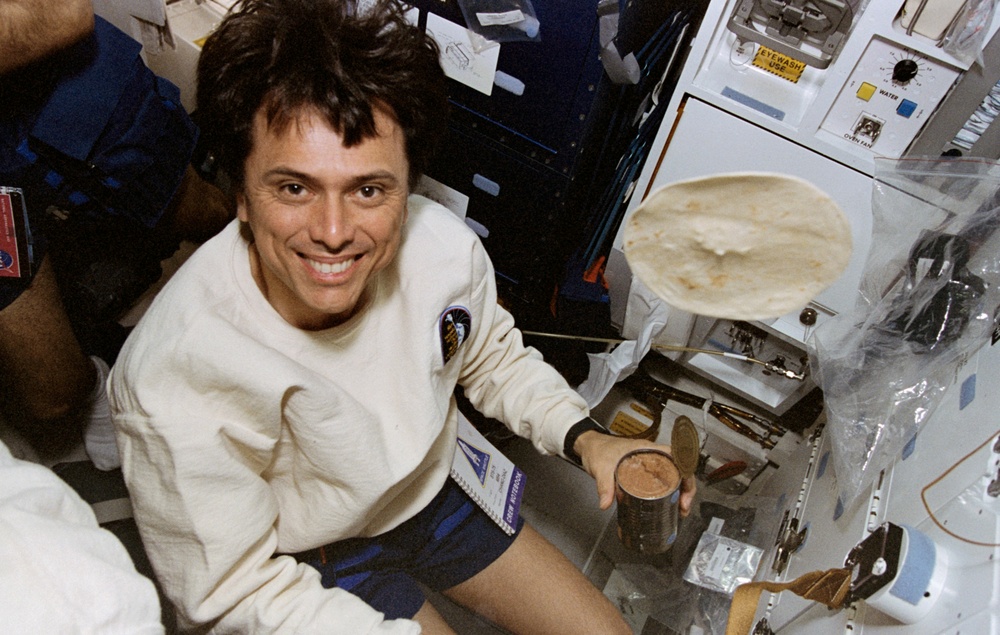 Astronaut Chang-Diaz making burritos in space