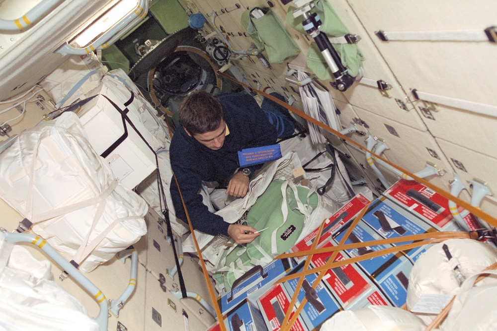 MS Malenchenko works with a stowage bag in Zarya during STS-106