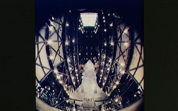Fisheye view of the Columbia being lifted above the floor of the VAB