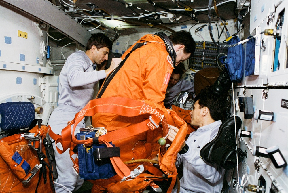 Various views of the STS-60 crew during deorbit preparations