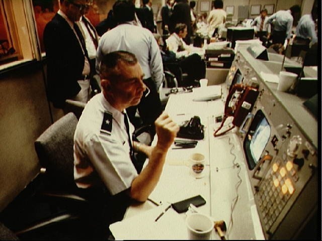 Brigadier General William T. Twinting seated at console in MCC