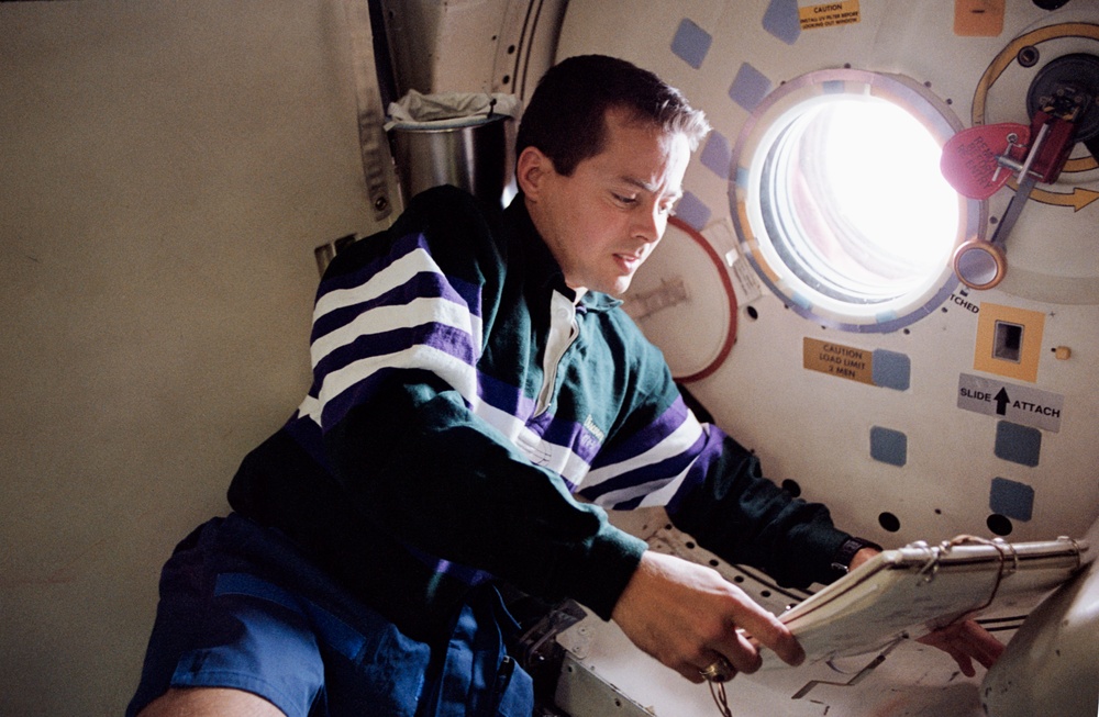 STS-51 crewmembers engage in activities