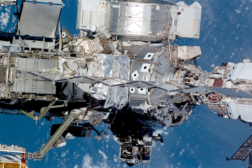 Exterior view of ISS during flyaround by STS-105 showing Z1 truss and Node 1