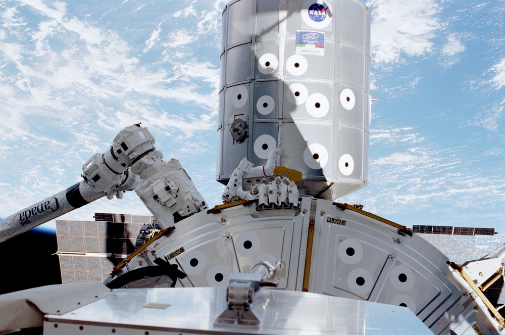 MS Hadfield working on Destiny during the second EVA of STS-100