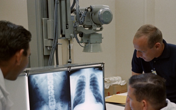 Astronaut Charles ''Pete'' Conrad, Jr. discusses x-rays with members of the medical team