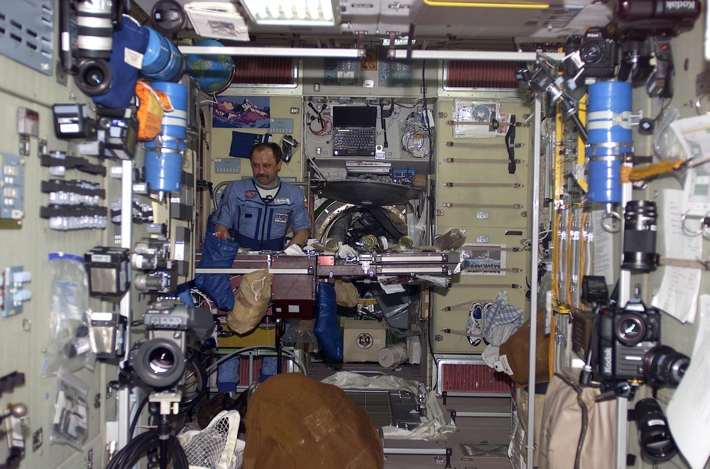 Usachev at ward room table in Service Module