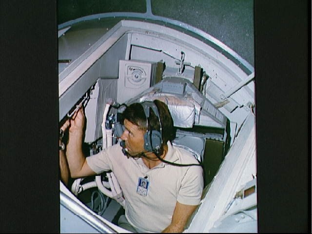 Astronaut Walter Schirra in cockpit of Gemini simulator