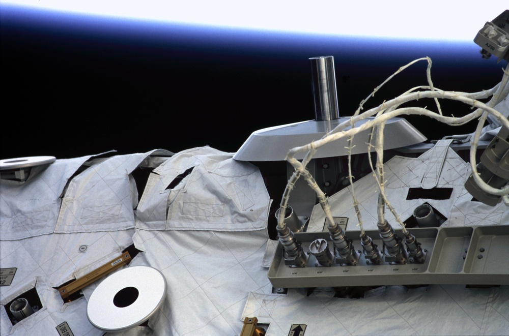 View of a Grapple Fixture and an Avionics Panel on the S0 Truss taken during STS-110