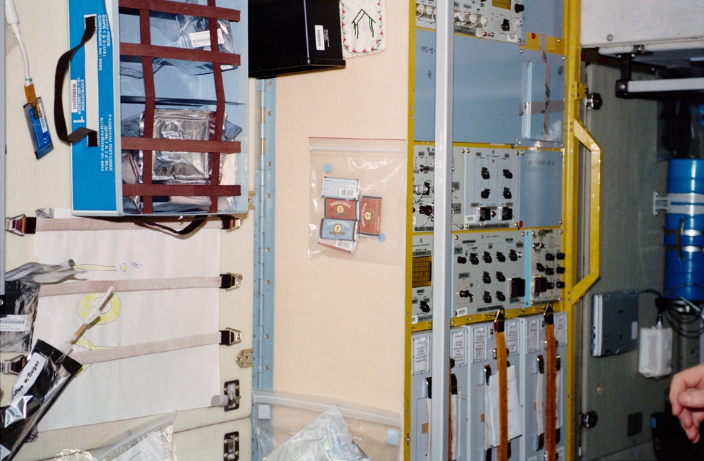 Panels, controls, food, and drink bags in the Zvezda SM