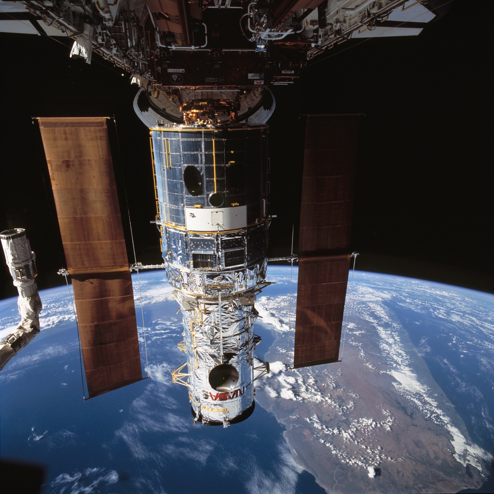 Hubble Space Telescope is berthed in Endeavour's payload bay after capture
