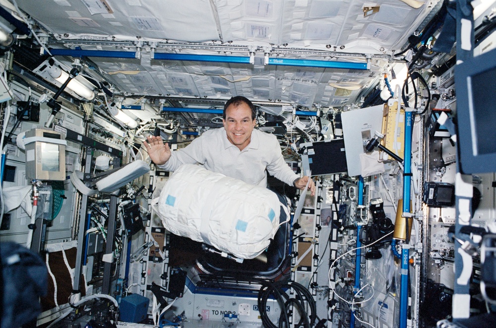 Bloomfield moves a CWC in Destiny during STS-110's visit to the ISS