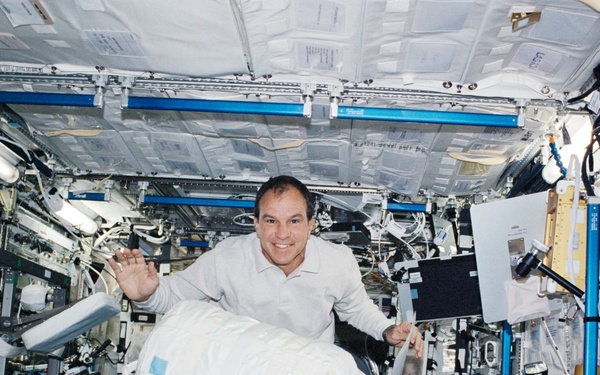 Bloomfield moves a CWC in Destiny during STS-110's visit to the ISS