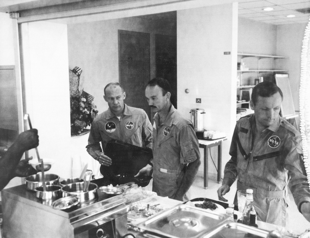 Apollo 11 crewmen dining in Crew Reception area of Lunar Receiving Lab