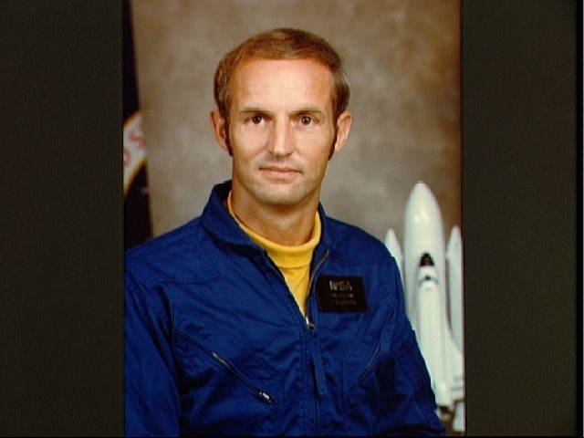 Portrait of Astronaut candidate Don E. Williams in blue flight suit.