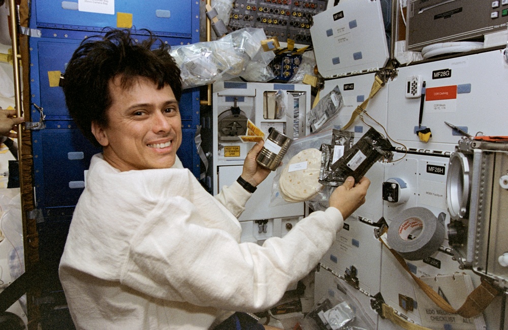 Astronaut Chang-Diaz making burritos in space