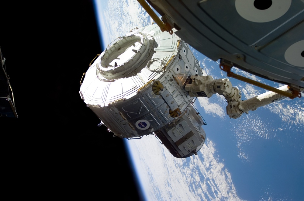 Quest airlock maneuvered into position