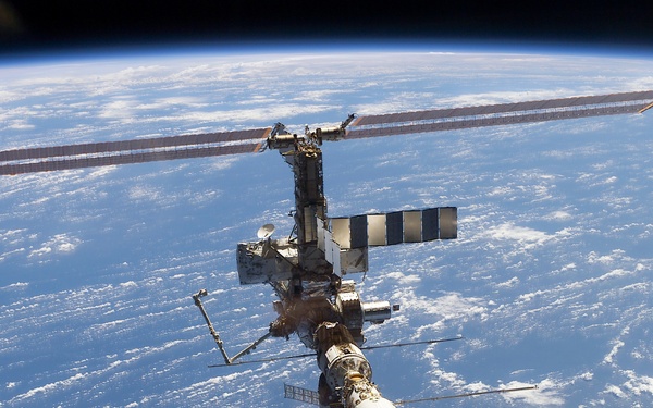 Aft - zenith view of the ISS taken during STS-110's undocking and final flyaround