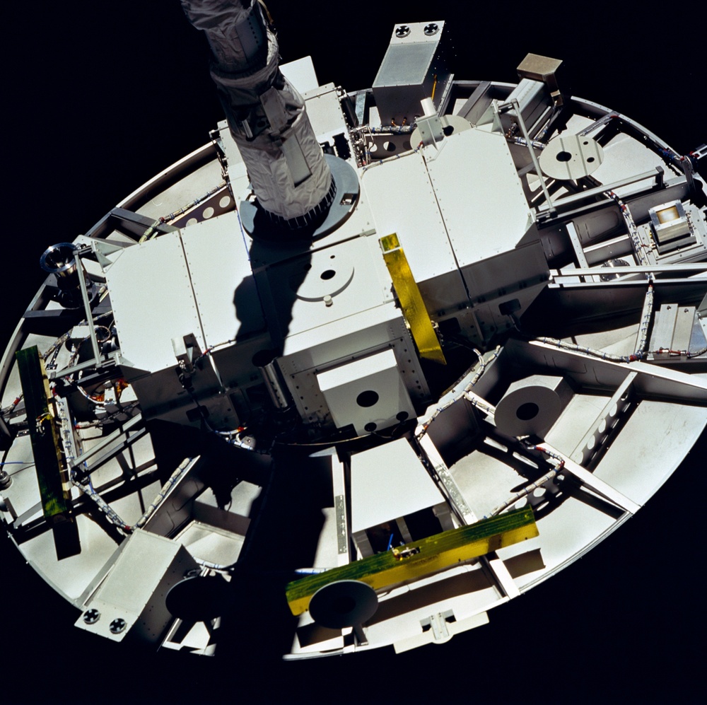 WSF, closeup of satellite grappled by RMS end effector