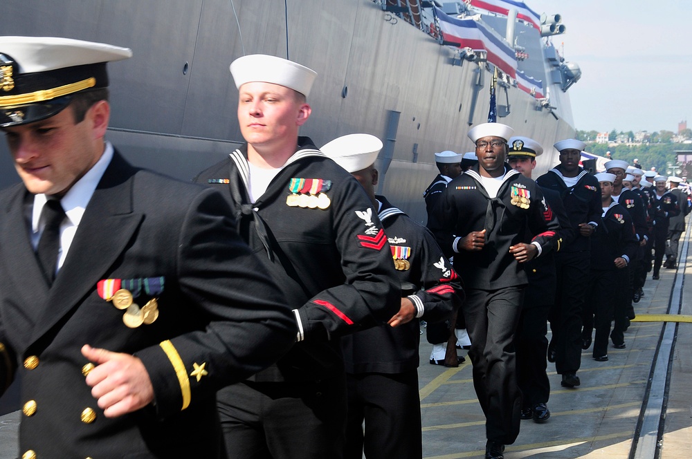 Sailors board USS Michael Murphy during commissioning ceremony