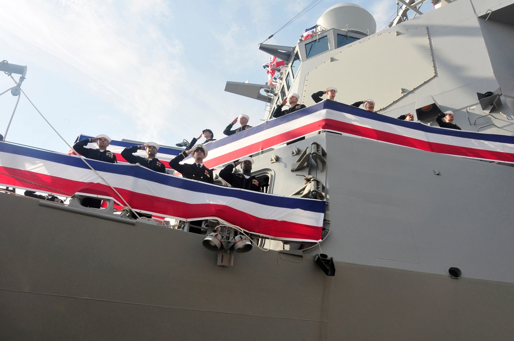 Sailors board USS Michael Murphy during commissioning ceremony