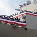 Sailors board USS Michael Murphy during commissioning ceremony