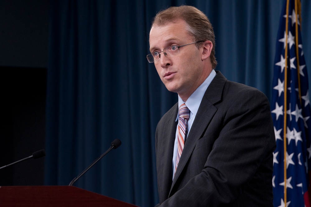 George Little briefs the press