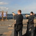 Sailors fire small arms on USS Underwood