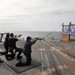 Sailors fire small arms on USS Underwood