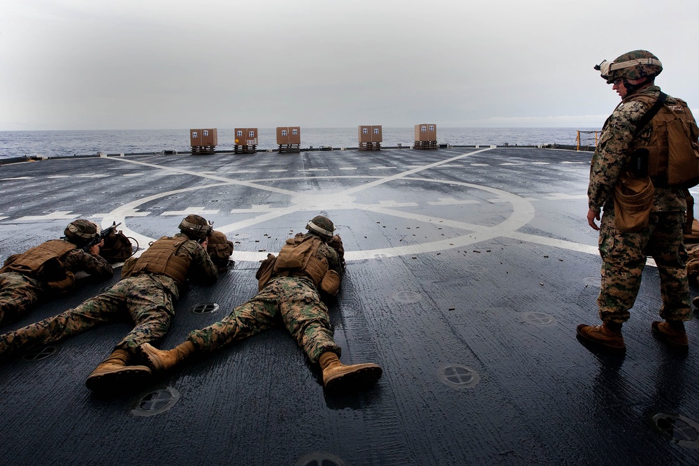 Marines BZO their weapons aboard USNS Lewis and Clark