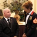 Sgt. Maj. Yolanda Mayo speaks with a sergeant major who lost his legs in Afghanistan