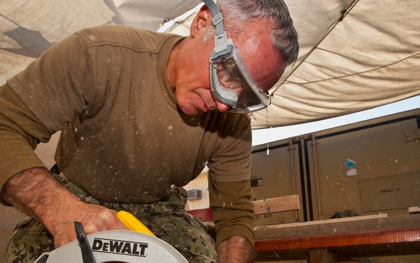 Navy Senior Chief builds toy box, self-esteem for kids at orphanage