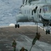 Marines fast rope onto flight deck of USS Peleliu