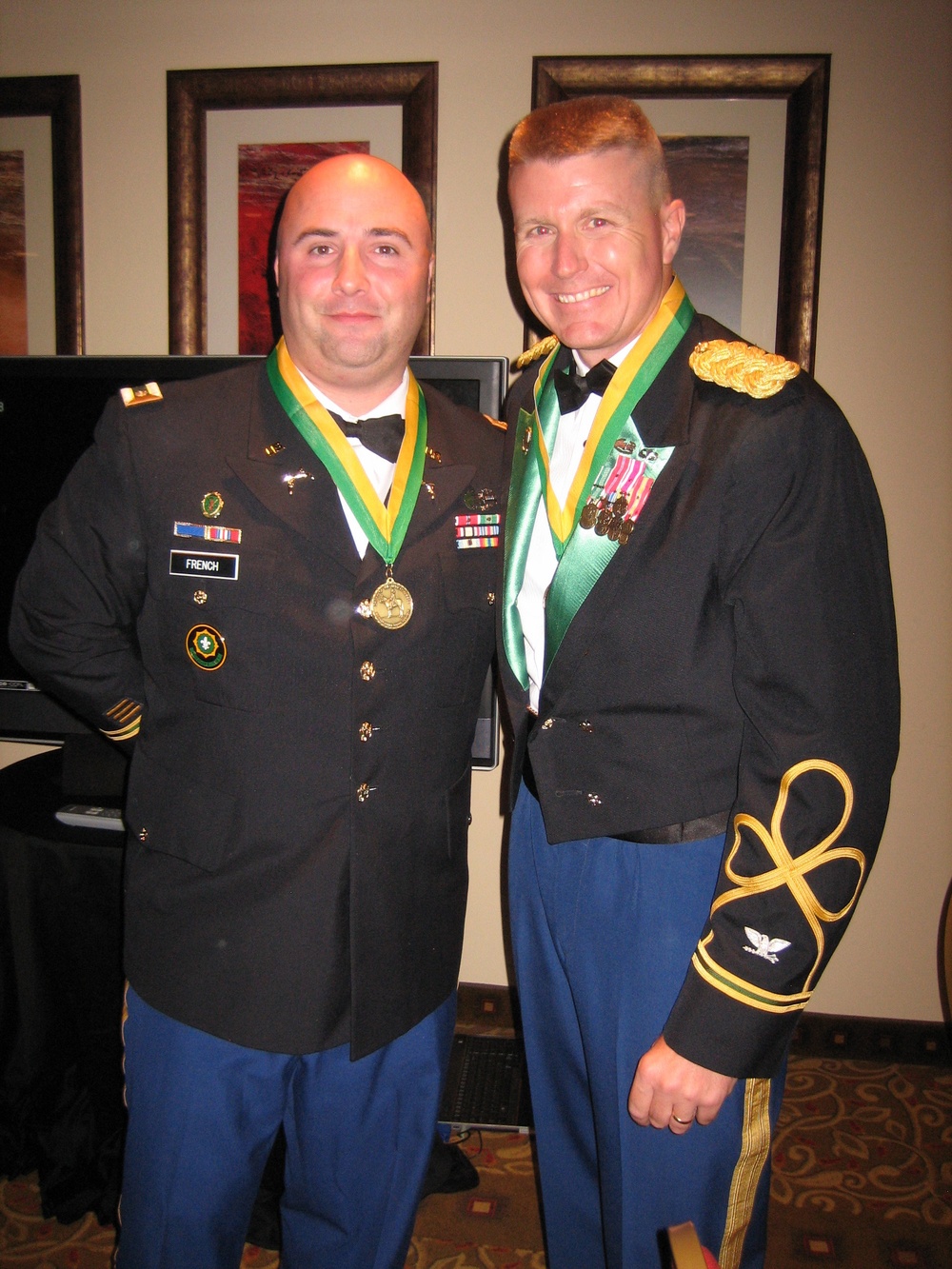 Col. Charles Buxton and Maj. George French receive the bronze award of the Order of Marechausee