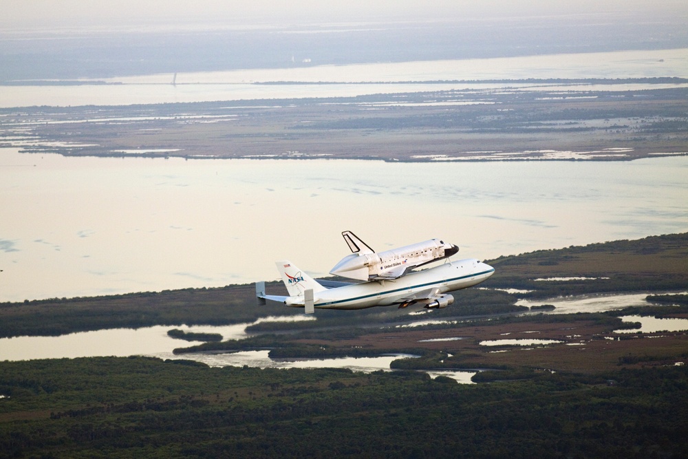 SCA Carrying Discovery Departs KSC (KSC-2012-2372)