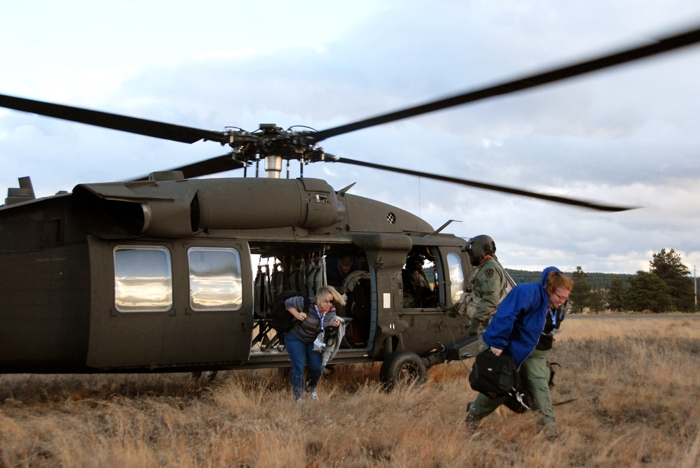 Employers of Guard members disembark from Black Hawk