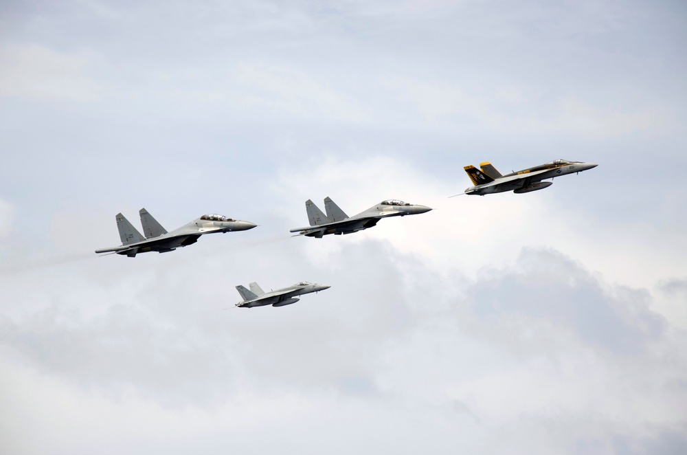 Aircraft fly above USS George Washington