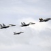 Aircraft fly above USS George Washington