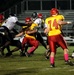 A Lejeune fullback gets taken down by three defenders