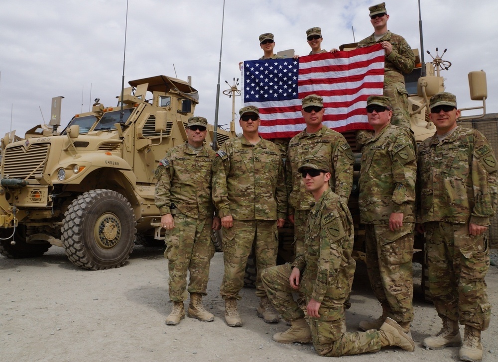 Deployed soldiers from the Kentucky National Guard's 63rd Theatre Aviation Brigade stand together in southern Afghanistan