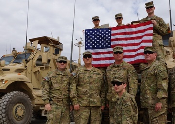 Deployed soldiers from the Kentucky National Guard's 63rd Theatre Aviation Brigade stand together in southern Afghanistan