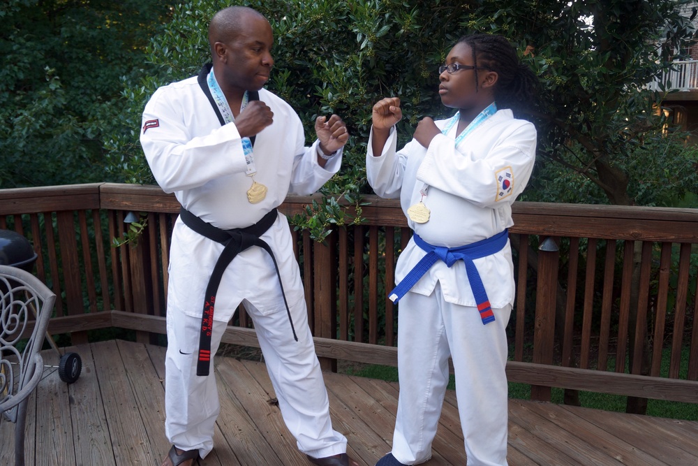 Tae Kwon do event brings civil affairs Soldier and daughter to Korea