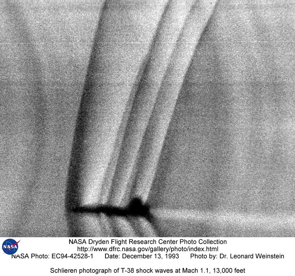 Schlieren photograph of T-38 shock waves at Mach 1.1, 13,000 feet