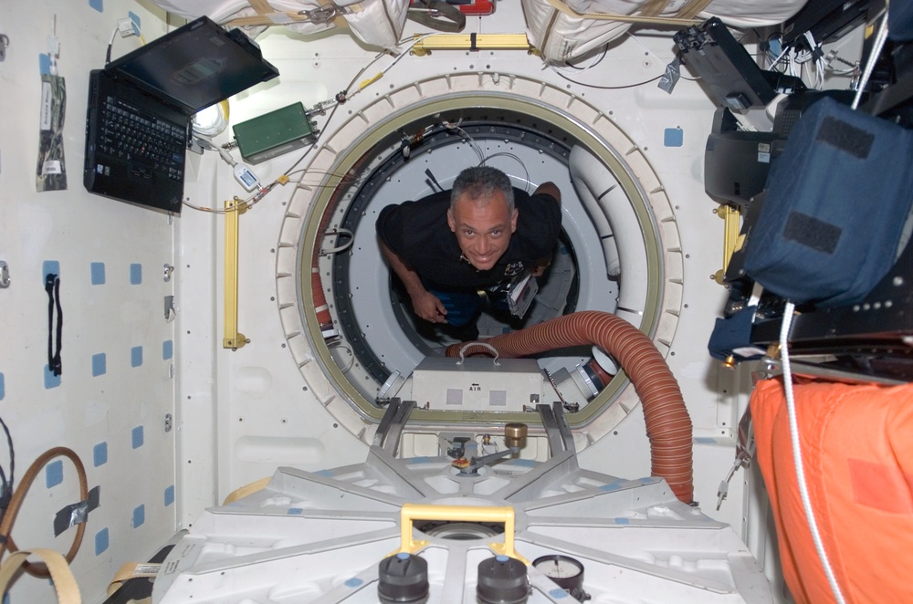 Olivas floats through hatch to the MDDK of STS-117 Space Shuttle Atlantis during Joint Operations