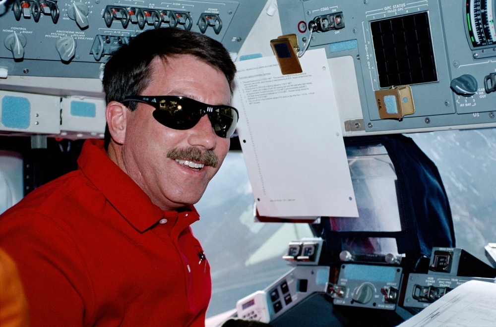 Commander Rominger at the commander's workstation in Endeavour during STS-100