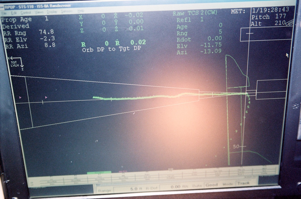 View of a laptop computer display on flight deck during the initial flyaround of STS-110