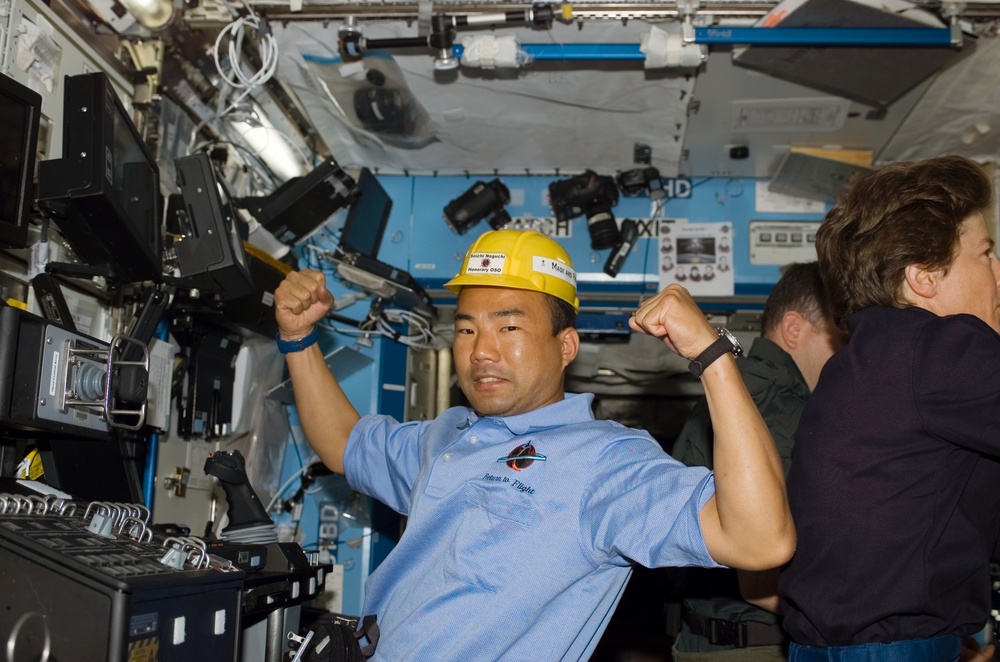 Noguchi in Destiny laboratory module wearing yellow hard hat