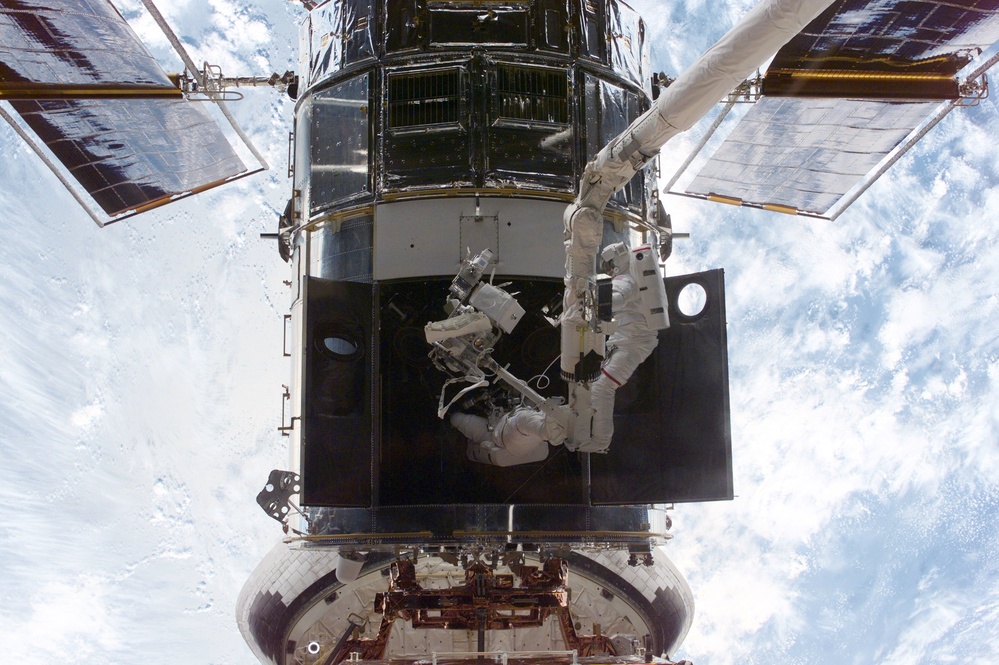 EVA 1 - Grunsfeld and Smith during RSU changeout