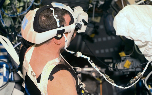 VEG - Williams in Spacelab with helmet